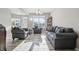 Charming living room featuring light gray walls, gray furniture, and wood style floors at 3254 S Ansley Dr, New Palestine, IN 46163