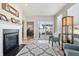 Inviting living room featuring a fireplace, a sliding glass door, and neutral decor at 3254 S Ansley Dr, New Palestine, IN 46163