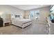 Inviting main bedroom features a large bed, soft carpet, a large window, and TV at 3254 S Ansley Dr, New Palestine, IN 46163