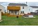 Spacious backyard featuring a wooden deck, a lower patio and a hot tub at 373 Springfield Cir, Greenwood, IN 46143