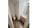Cozy half bath with a vanity, mirror, and toilet, all complemented by patterned flooring at 373 Springfield Cir, Greenwood, IN 46143