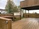 Spacious wooden deck with a hot tub and privacy fence, perfect for outdoor entertaining at 373 Springfield Cir, Greenwood, IN 46143