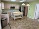 Bright kitchen featuring light wood cabinets, stainless steel appliances, and a kitchen island at 373 Springfield Cir, Greenwood, IN 46143