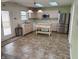 Bright kitchen featuring light wood cabinets, stainless steel appliances, a kitchen island and a door to the deck at 373 Springfield Cir, Greenwood, IN 46143