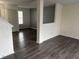 Open-concept layout with sleek flooring, neutral walls, and a staircase leading to the upper level at 373 Springfield Cir, Greenwood, IN 46143