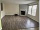 Inviting living room with a fireplace, large windows for natural light, and modern flooring at 373 Springfield Cir, Greenwood, IN 46143