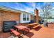 A brick patio with a dining area, complete with outdoor grill and exterior home view at 3940 E 600 N, Columbus, IN 47203