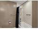 A clean bathroom featuring a shower-tub combo with a shower curtain and tile walls at 3940 E 600 N, Columbus, IN 47203