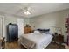Well lit bedroom featuring a bed, a safe, and wood-look flooring at 3940 E 600 N, Columbus, IN 47203