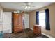 Bedroom featuring a window with dark curtains, and wood-look flooring at 3940 E 600 N, Columbus, IN 47203