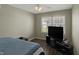 Bright bedroom featuring a ceiling fan, a window, and wood-look flooring at 3940 E 600 N, Columbus, IN 47203