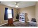 Bedroom featuring a ceiling fan, a window, and wood-look flooring at 3940 E 600 N, Columbus, IN 47203