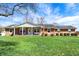Inviting brick home with a charming front porch and well-manicured lawn at 3940 E 600 N, Columbus, IN 47203