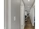 Bright hallway featuring wood-look flooring that leads to other rooms of the house at 3940 E 600 N, Columbus, IN 47203