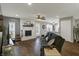 Inviting living room with fireplace, wood floors, and a view into the kitchen, creating a seamless flow at 3940 E 600 N, Columbus, IN 47203
