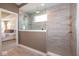 Modern tiled shower with glass divider, gold fixtures, and a view into the bedroom at 4034 Saddle Club S Pkwy, Bargersville, IN 46106