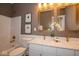 Elegant bathroom featuring a double vanity, gold fixtures, and a tub and shower combination at 4034 Saddle Club S Pkwy, Bargersville, IN 46106