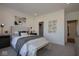 Serene bedroom featuring neutral tones, paneled accent wall, and comfortable upholstered seating bench at 4034 Saddle Club S Pkwy, Bargersville, IN 46106