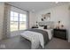 Bright bedroom with large window, neutral decor, and upholstered bench at the foot of the bed at 4034 Saddle Club S Pkwy, Bargersville, IN 46106