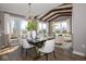 An open dining area with a decorative chandelier and sun-filled windows at 4034 Saddle Club S Pkwy, Bargersville, IN 46106