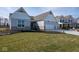 Beautiful home with brick exterior, three car garage, and a lush green lawn at 4034 Saddle Club S Pkwy, Bargersville, IN 46106
