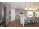 Spacious kitchen features gray cabinets, a center island with bar seating, and stainless steel appliances at 4034 Saddle Club S Pkwy, Bargersville, IN 46106