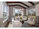 The living room boasts cathedral ceilings, wood beams, recessed lights, and views of the backyard at 4034 Saddle Club S Pkwy, Bargersville, IN 46106