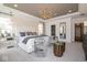 Spacious main bedroom with elegant seating area, pendant lighting, and a view into the bathroom at 4034 Saddle Club S Pkwy, Bargersville, IN 46106