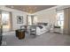Bright main bedroom suite with large windows, tray ceiling, and elegant decor at 4034 Saddle Club S Pkwy, Bargersville, IN 46106