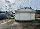 Exterior shot of a white detached garage with a double door, set against a cloudy sky at 4151 Bowman Ave, Indianapolis, IN 46227
