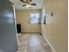 Bright kitchen nook with a ceiling fan, window, and neutral walls at 4151 Bowman Ave, Indianapolis, IN 46227