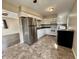 Functional kitchen with white cabinetry, stainless steel refrigerator, and modern appliances at 4151 Bowman Ave, Indianapolis, IN 46227