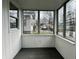 Bright sunroom featuring multiple windows and a neutral color scheme at 4151 Bowman Ave, Indianapolis, IN 46227