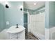 This updated bathroom featuring a shower with glass doors at 420 N Irvington Ave, Indianapolis, IN 46219