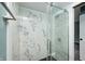 Updated bathroom featuring a marble shower and sliding glass door at 420 N Irvington Ave, Indianapolis, IN 46219