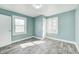 Bedroom featuring fresh paint, hard surface floors, and natural light from windows at 420 N Irvington Ave, Indianapolis, IN 46219