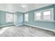 Bright bedroom filled with natural light from multiple windows and hard surface floors at 420 N Irvington Ave, Indianapolis, IN 46219