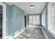 Sun-filled living room with gray floors and view of a window at 420 N Irvington Ave, Indianapolis, IN 46219