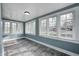 Bright, airy room boasts new flooring, natural light, and neutral color scheme at 420 N Irvington Ave, Indianapolis, IN 46219
