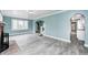 Open living area with new flooring, and arched doorways to other rooms at 420 N Irvington Ave, Indianapolis, IN 46219