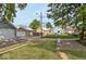 View of the backyard area showcases an array of garages behind several charming residential houses at 430 Parkway Ave, Indianapolis, IN 46225