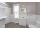 Clean bathroom with a classic design and a large window providing natural light at 430 Parkway Ave, Indianapolis, IN 46225