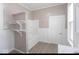 Bathroom featuring shelving and a shower/tub combo, with white wainscoting detail at 430 Parkway Ave, Indianapolis, IN 46225