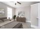 Serene bedroom with a plant, stylish decor and a gray accent wall and bedside table at 430 Parkway Ave, Indianapolis, IN 46225