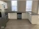 Well-lit kitchen with modern stainless steel appliances, and gray countertops at 430 Parkway Ave, Indianapolis, IN 46225