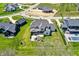 Aerial view features home with an inviting patio, seating area, and a lush, green lawn at 5130 Melbourne Pl, Zionsville, IN 46077