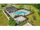 A scenic view of the pool, hot tub and clubhouse area with surrounding greenery at 5130 Melbourne Pl, Zionsville, IN 46077