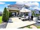 Well-maintained backyard with a patio, lounge chairs, and manicured landscaping, perfect for relaxation and enjoyment at 5130 Melbourne Pl, Zionsville, IN 46077