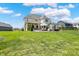 Large, green backyard featuring a patio, outdoor grill, and lush landscaping, ideal for entertaining and relaxing at 5130 Melbourne Pl, Zionsville, IN 46077