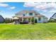 Extensive backyard with a patio, fire pit, and beautiful landscaping, offering plenty of space for recreation and relaxation at 5130 Melbourne Pl, Zionsville, IN 46077